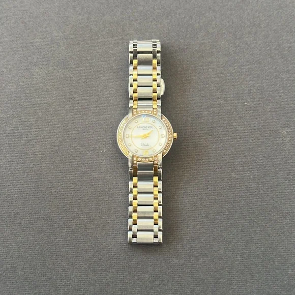 RAYMOND WEIL Steel Diamond and 18 k Yellow Gold Crown and